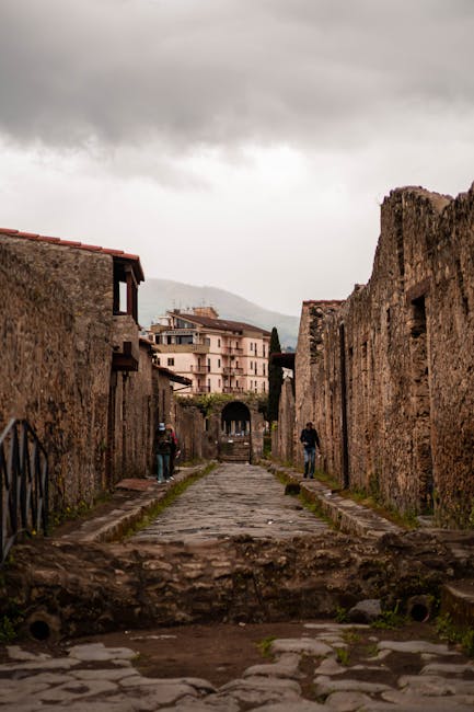 Cobblestone Road and Ruins in Town in Italy