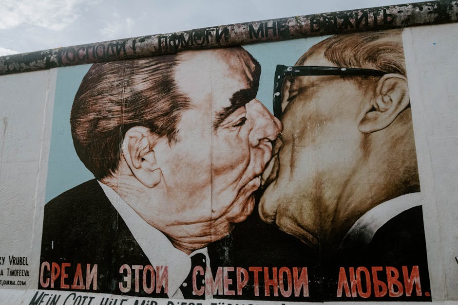 Iconic mural depicting two statesmen kissing, at Berlin Wall.